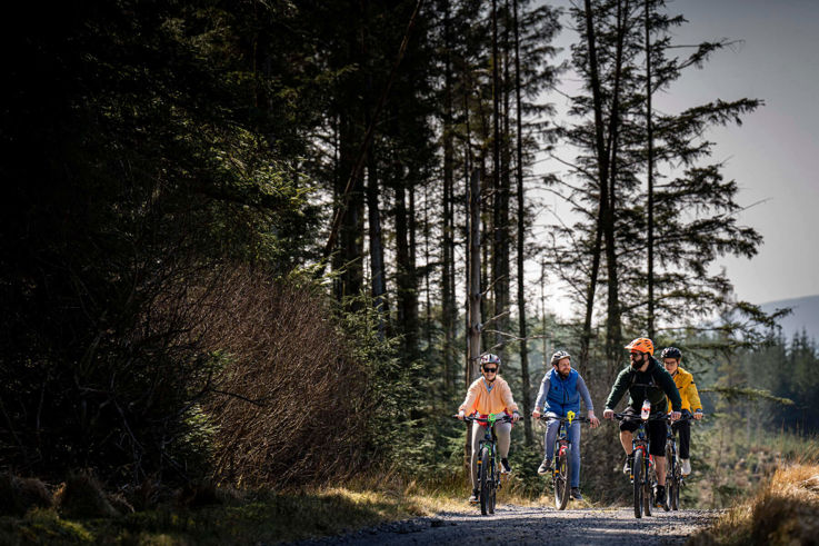 Friends riding electric bikes at  Corralea Activity Centre