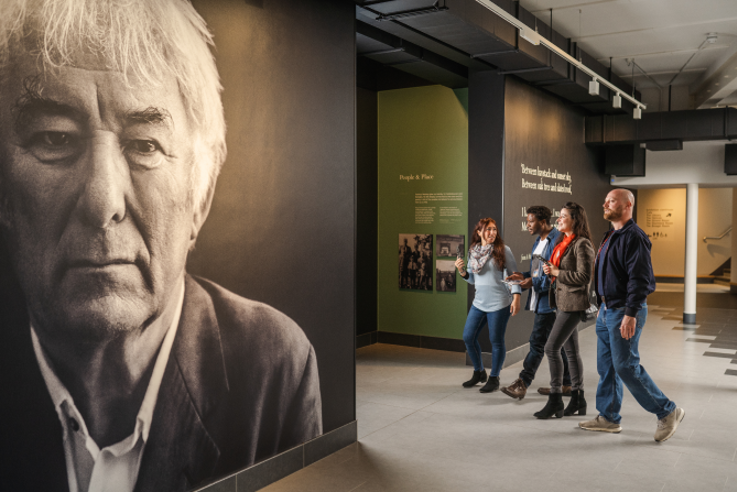 Visitors walking round Seamus Heaney HomePlace
